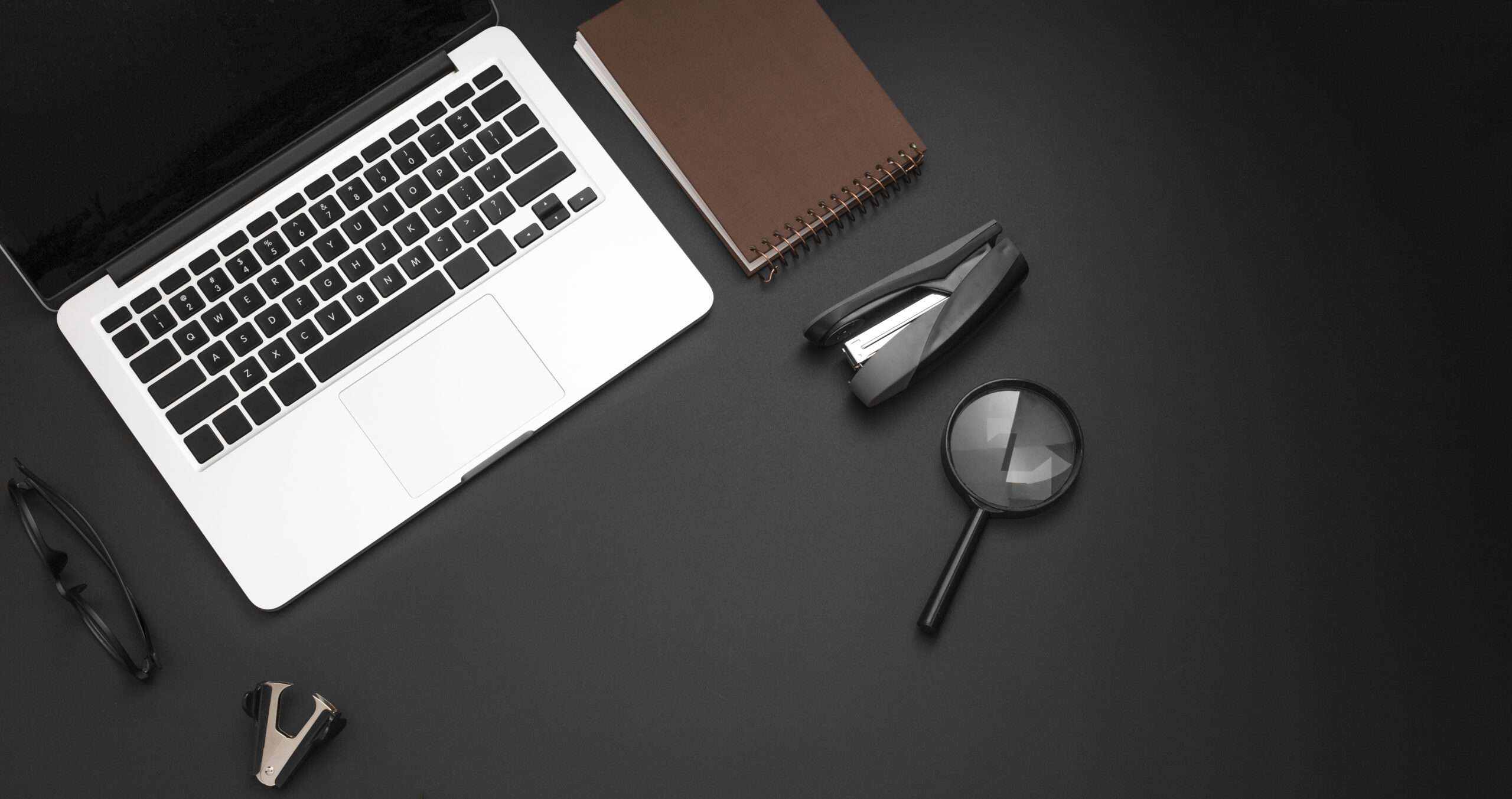 flat lay desktop with laptop magnifier